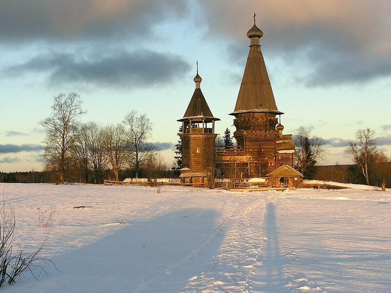 Wooden church in winter landscape