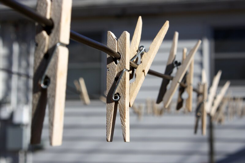 Wooden clothespins on a line