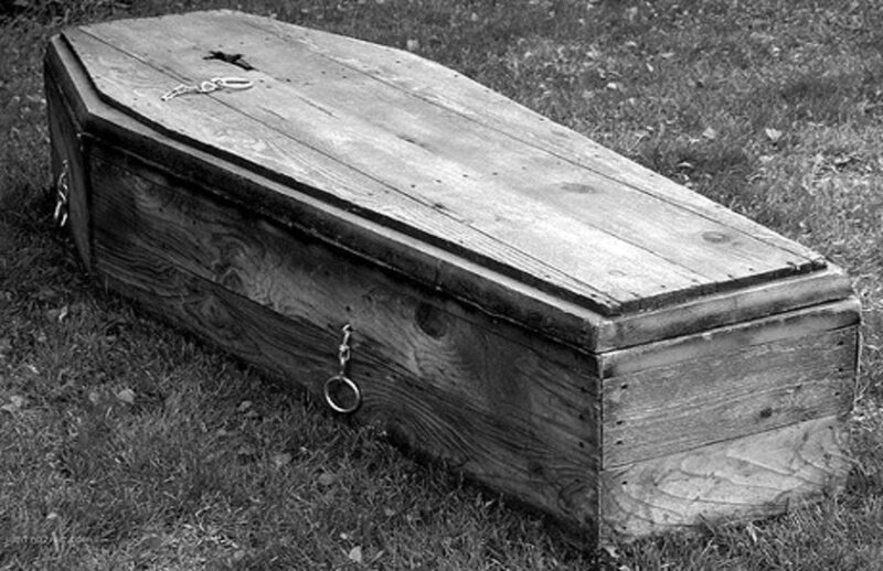 Wooden Coffin on Grass