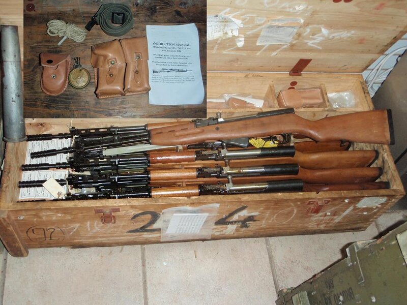 Wooden crate with rifles and accessories