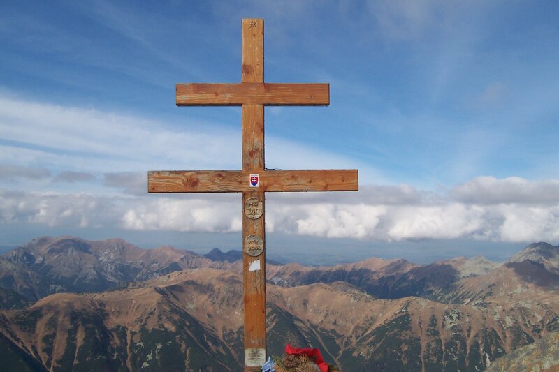 Wooden cross on mountain peak