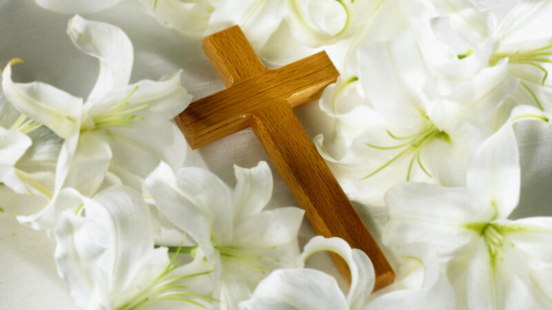 wooden cross with white lilies