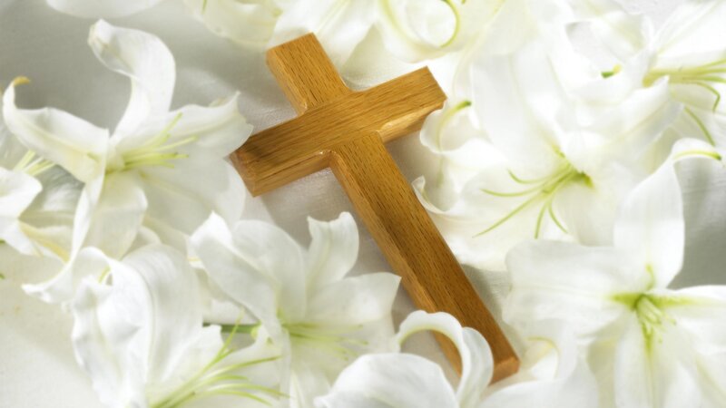 Wooden cross with white lilies