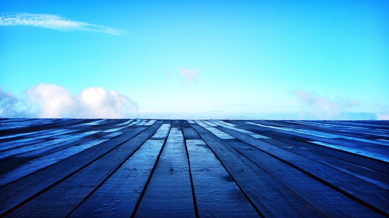 wooden deck under blue sky