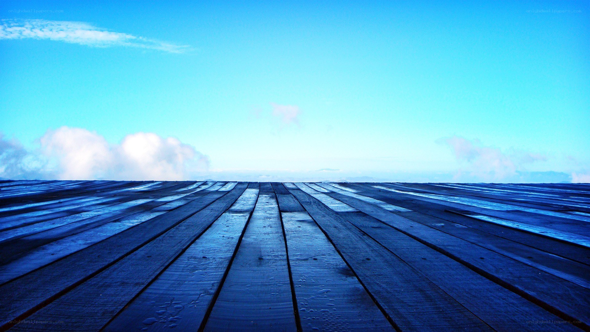 wooden deck under blue sky