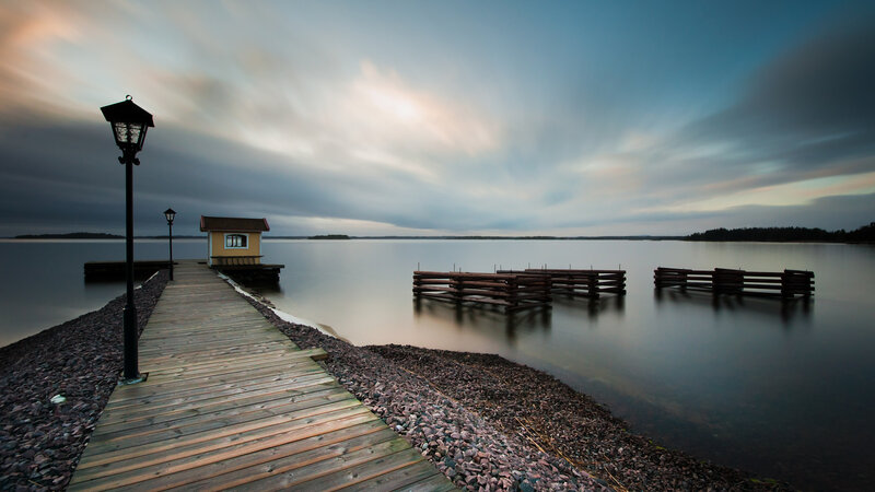 Wooden Dock at Dusk — Blue, Serene, Sunset, Photograph, Lamp Post