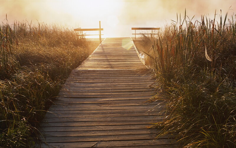 Wooden dock at sunrise
