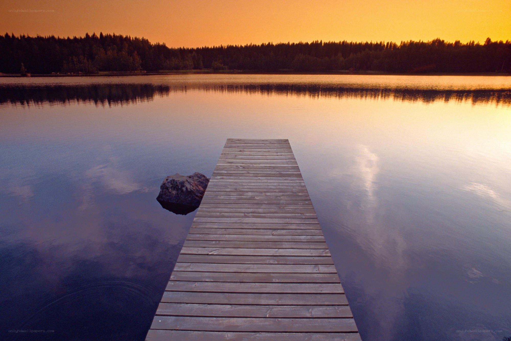 Wooden dock at sunset