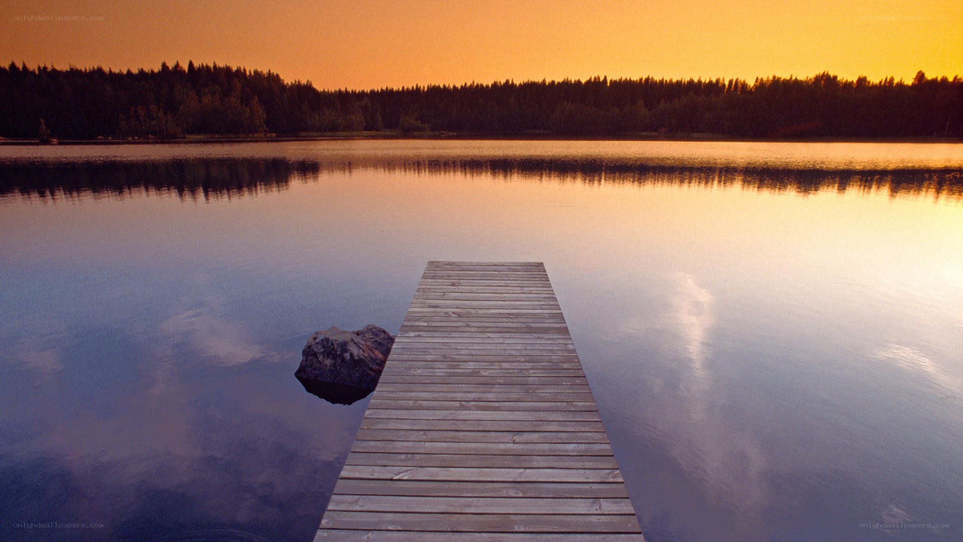 Wooden dock at sunset