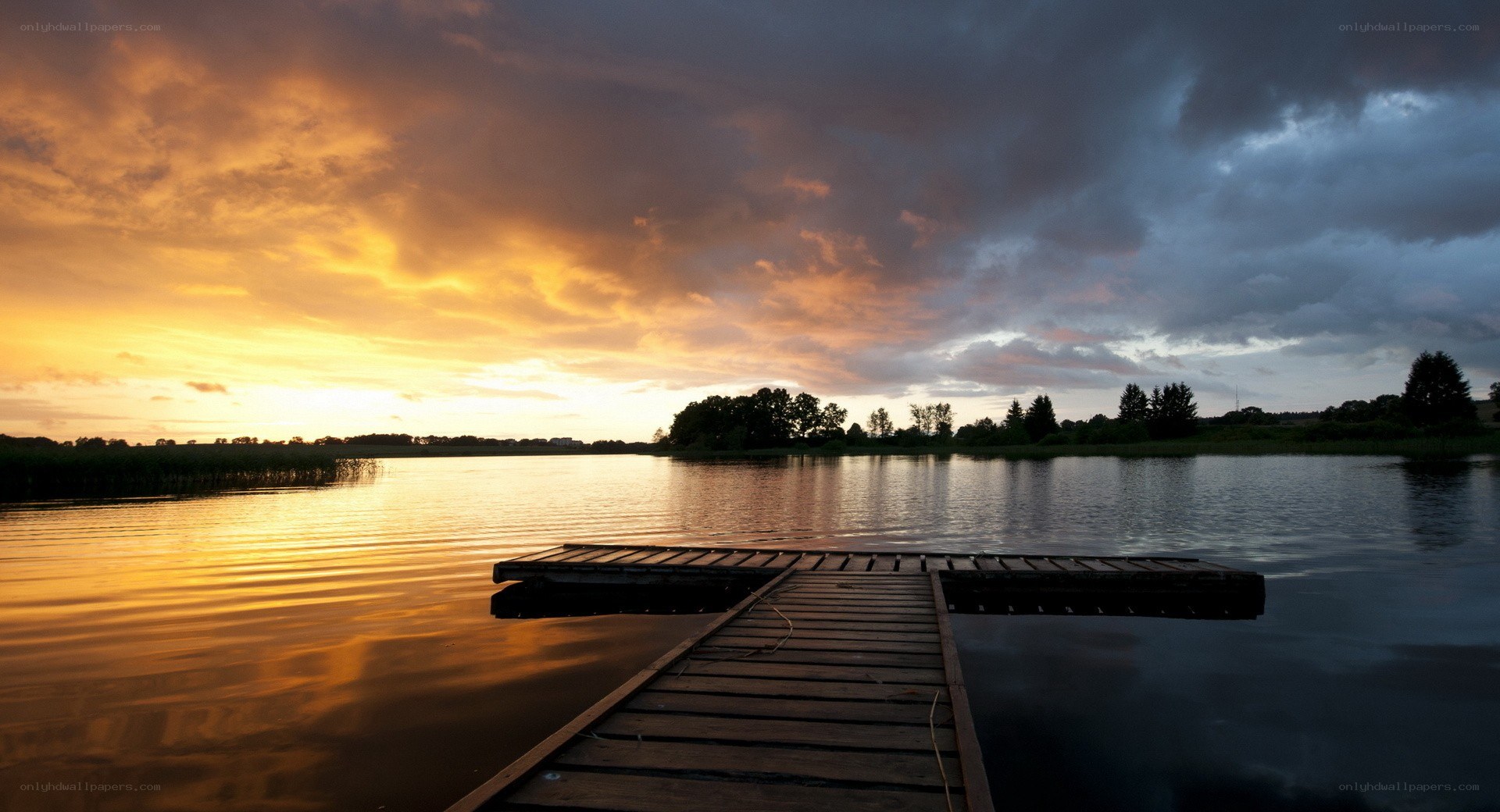 Wooden dock at sunset
