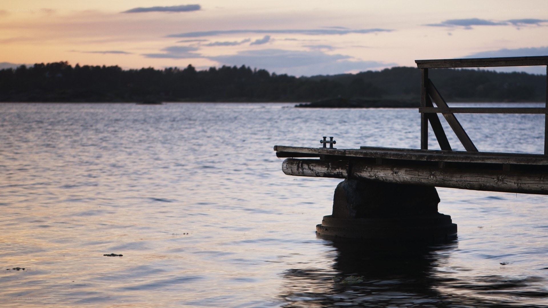 wooden dock at sunset