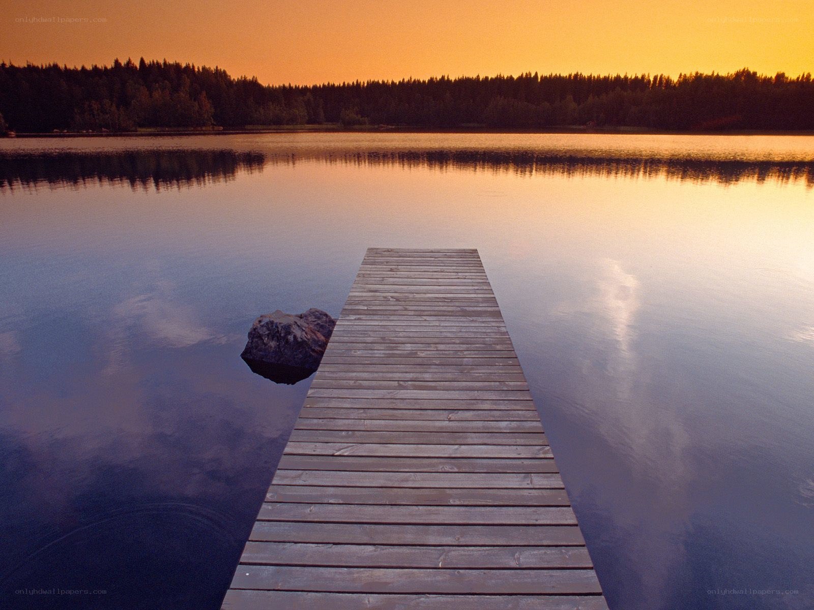 Wooden dock at sunset