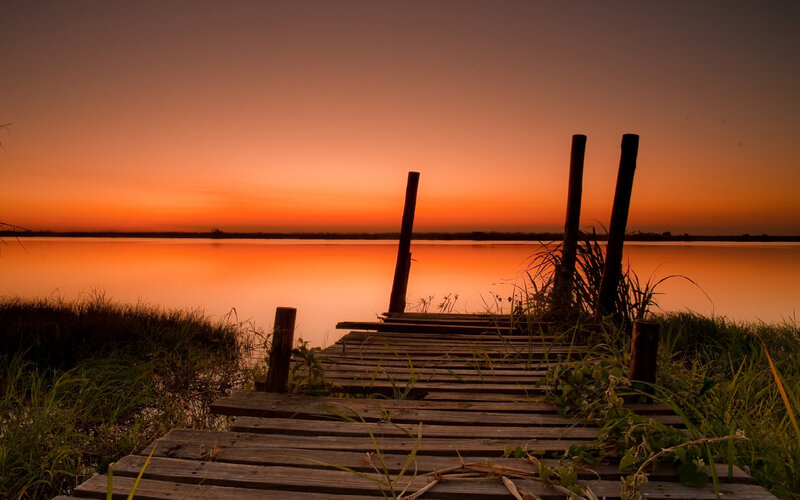Wooden dock at sunset