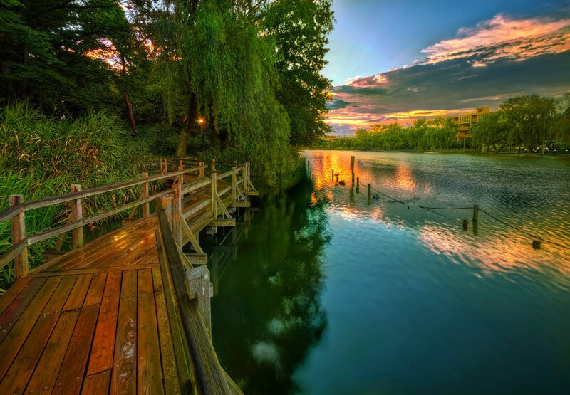 Wooden Dock at Sunset — Blue, Serene, Photograph, Lake, Trees, Building