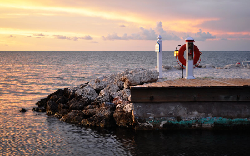 Wooden Dock at Sunset — Orange, Serene, Photograph, Life Preserver