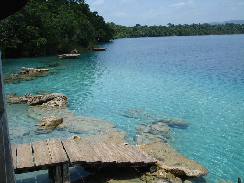Wooden dock at turquoise lake