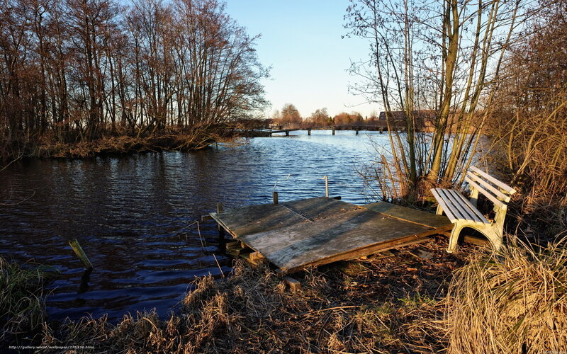 Wooden dock by a river