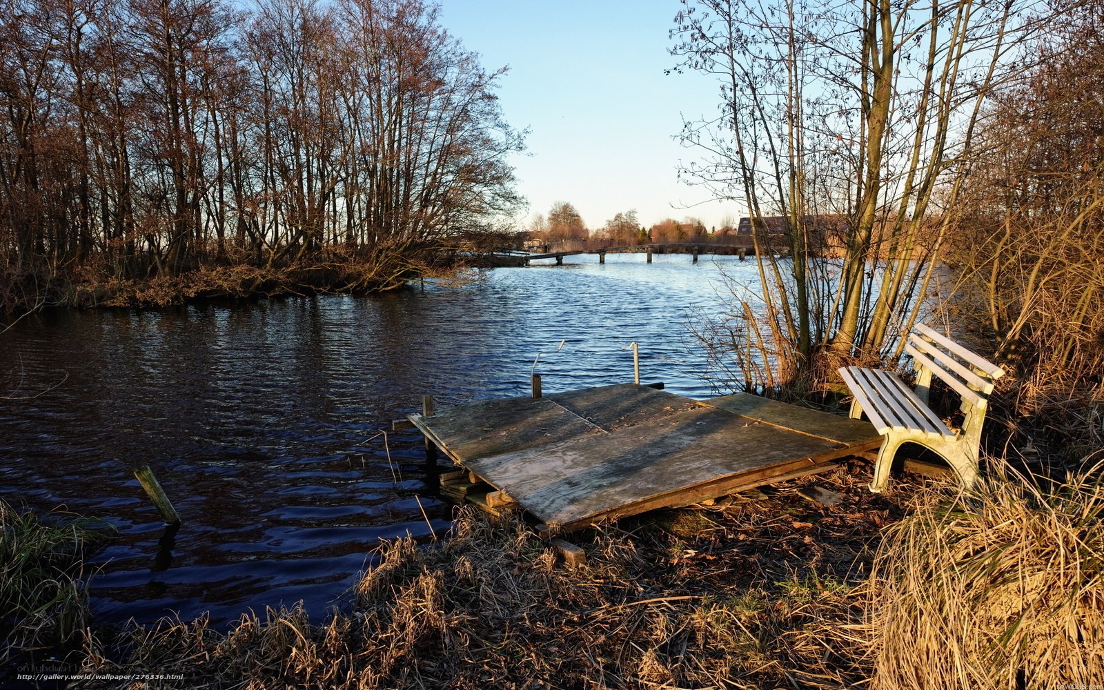 Wooden dock by a river