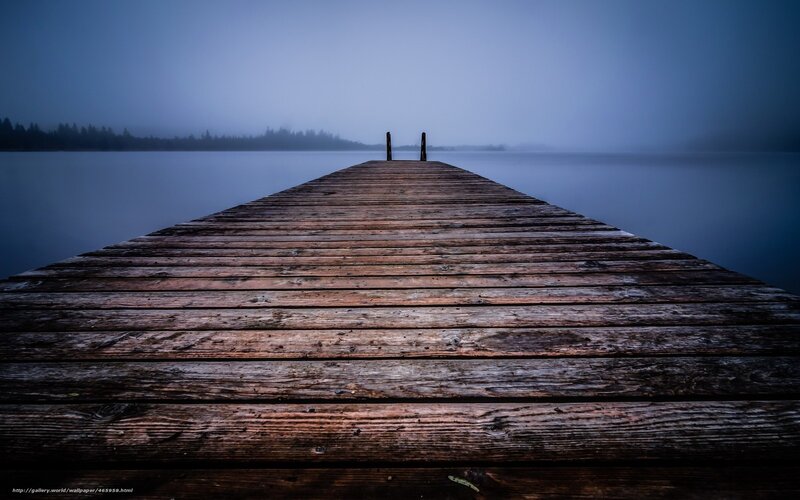 Wooden dock on a misty lake