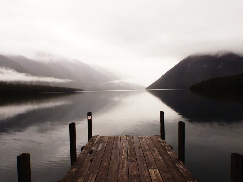 Wooden dock on a misty lake