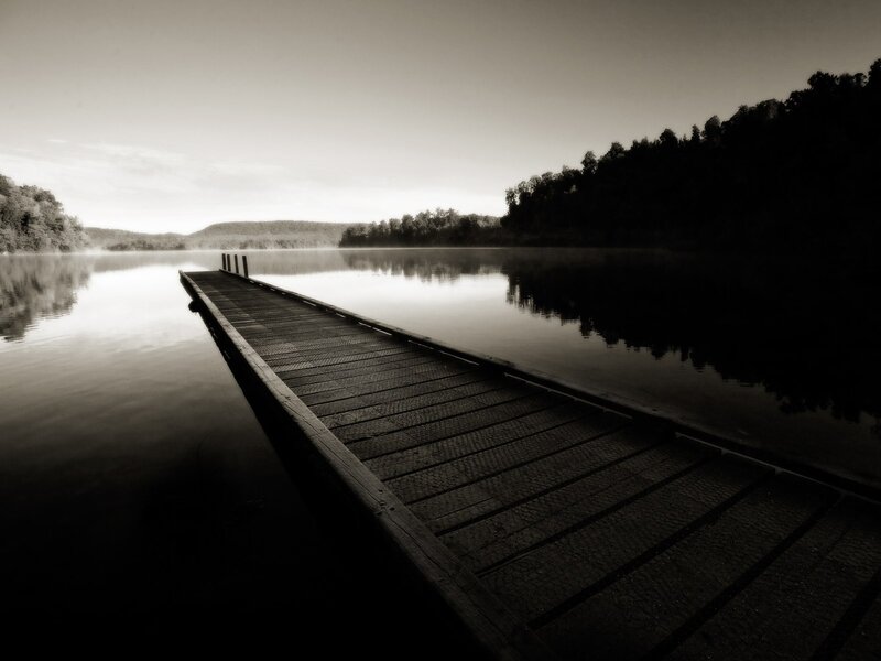 Wooden dock on a misty lake