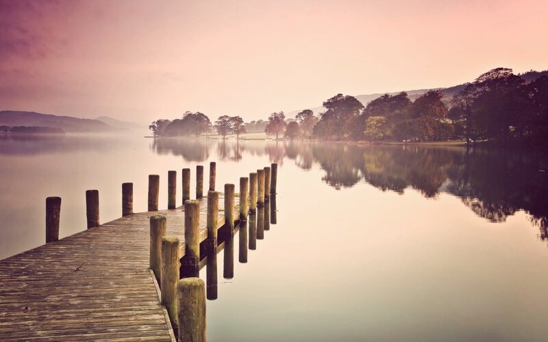 Wooden dock on a misty lake
