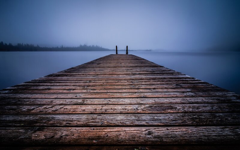 Wooden dock on a misty lake