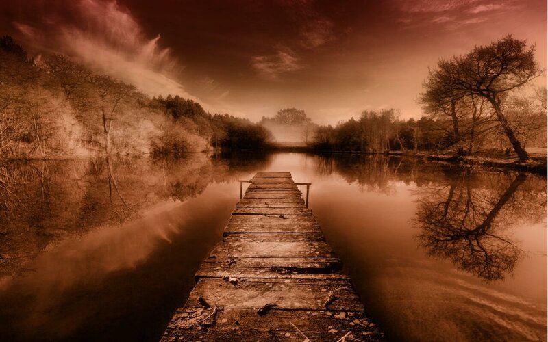 Wooden dock on a misty lake
