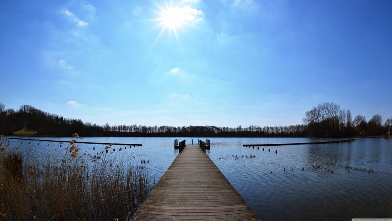 Wooden dock on a sunny lake