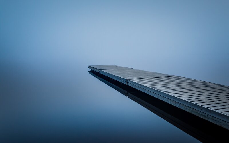 Wooden dock on calm water