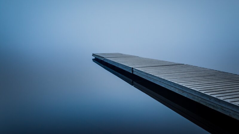 Wooden Dock on Calm Water — Blue, Serene, Morning