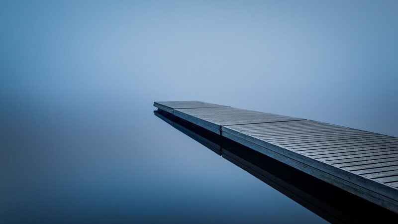 Wooden Dock on Calm Water — Blue