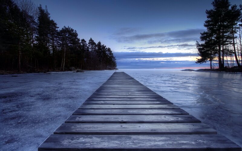 Wooden dock on frozen lake