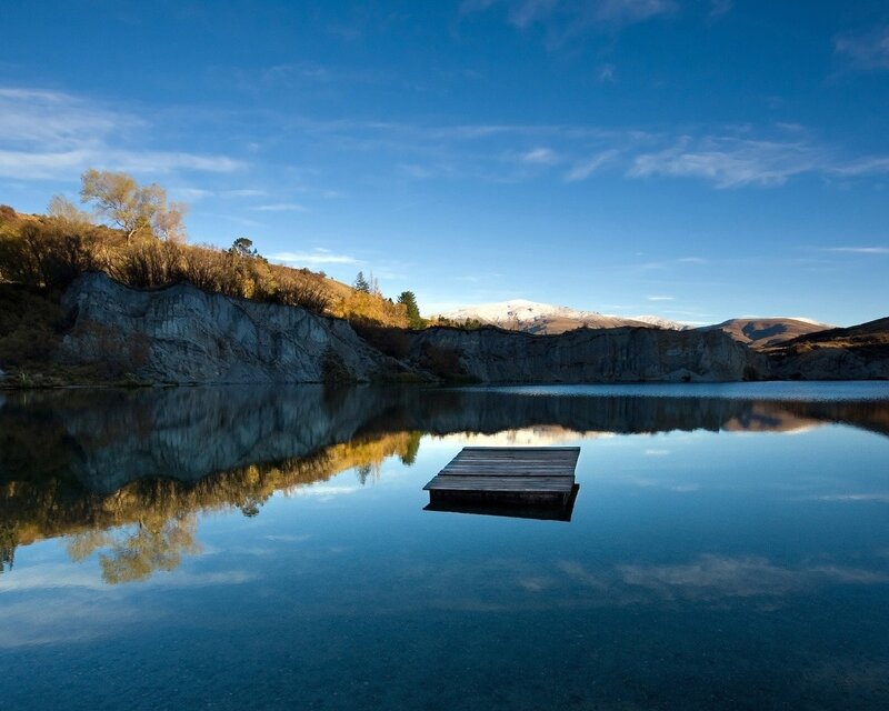 Wooden Dock on Lake — Blue, Serene, Afternoon, Photograph, Cliff