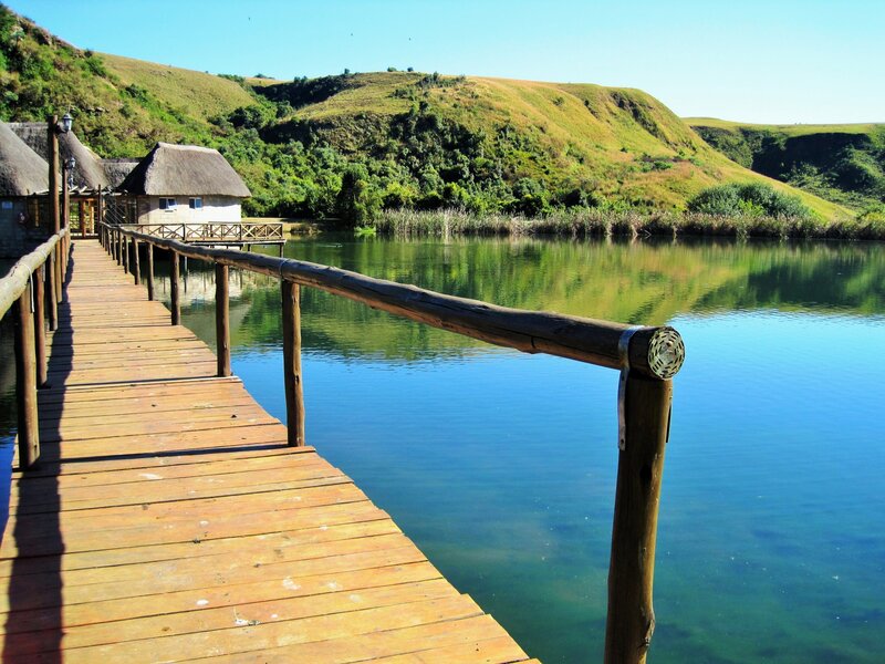 Wooden Dock on Lake — Blue, Serene, Afternoon, Photograph, Thatched Huts