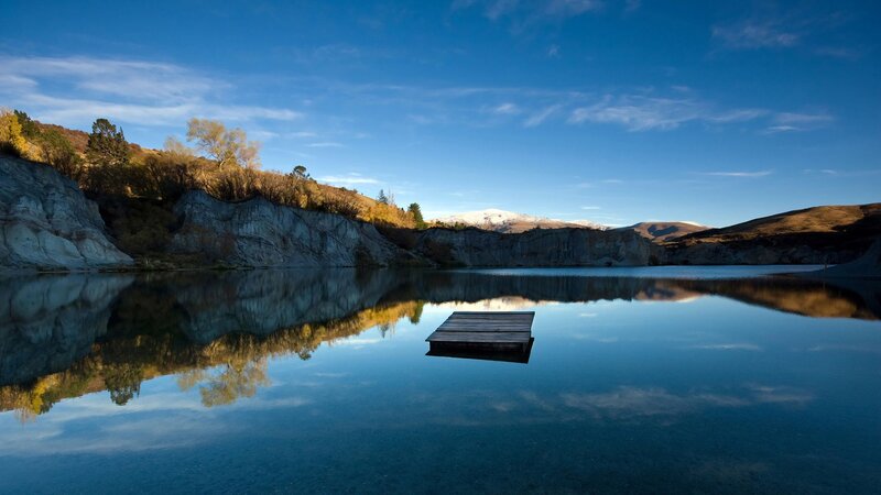 Wooden Dock on Lake — Blue, Serene, Autumn, Photograph, Cliffs, Mountains