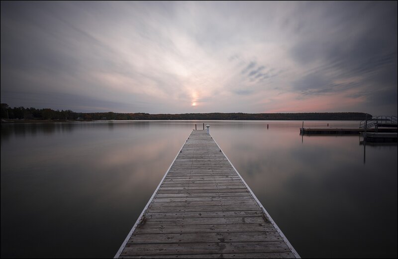 Wooden Dock on Lake — Gray, Serene, Sunset, Photograph