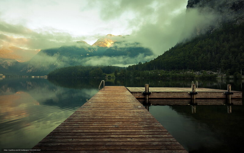 Wooden dock on misty lake