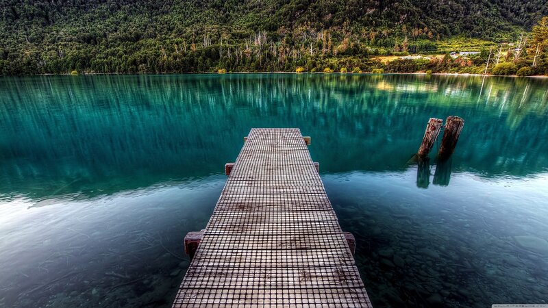 Wooden dock on turquoise lake
