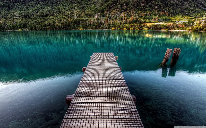 Wooden dock on turquoise lake