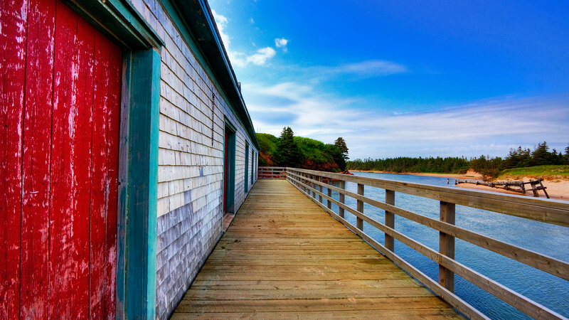 Wooden Dock with Red Building