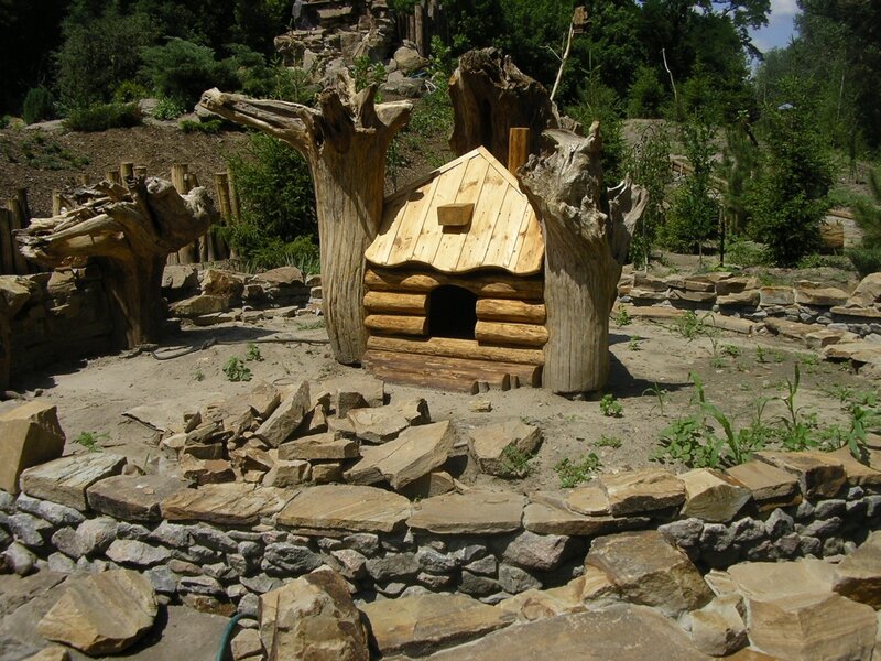 wooden dog house in garden