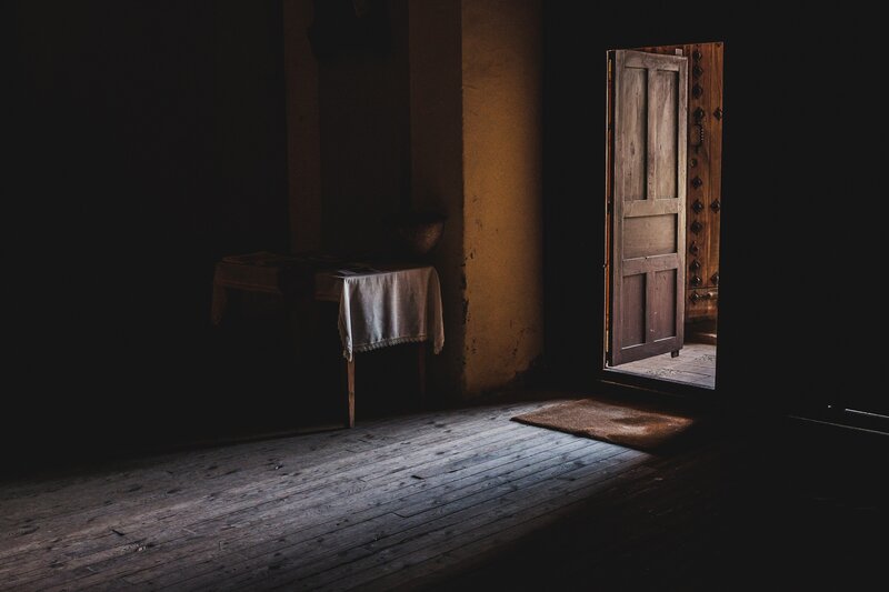 Wooden Door in Dark Room