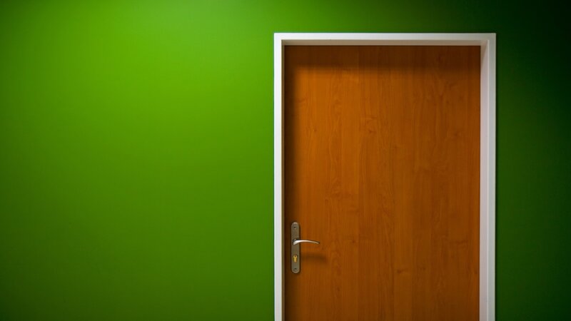 Wooden Door on Green Wall