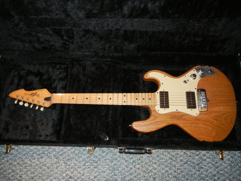 wooden electric guitar in case