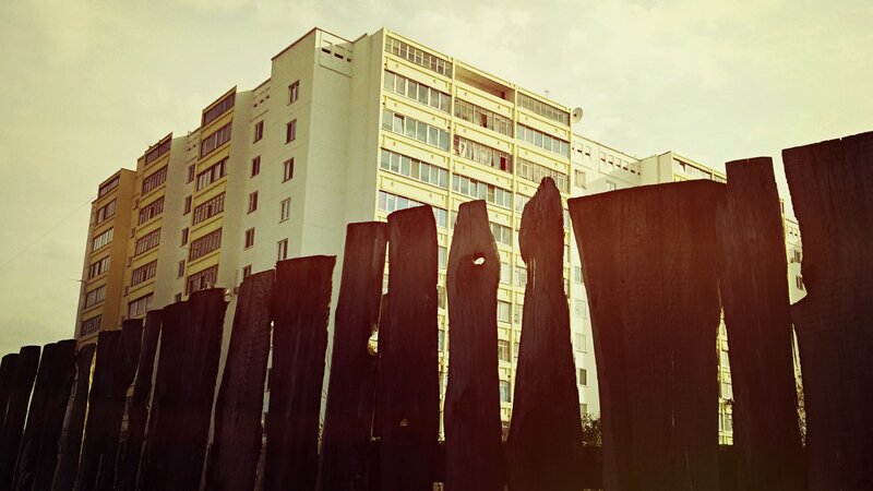 Wooden Fence and Apartment Building