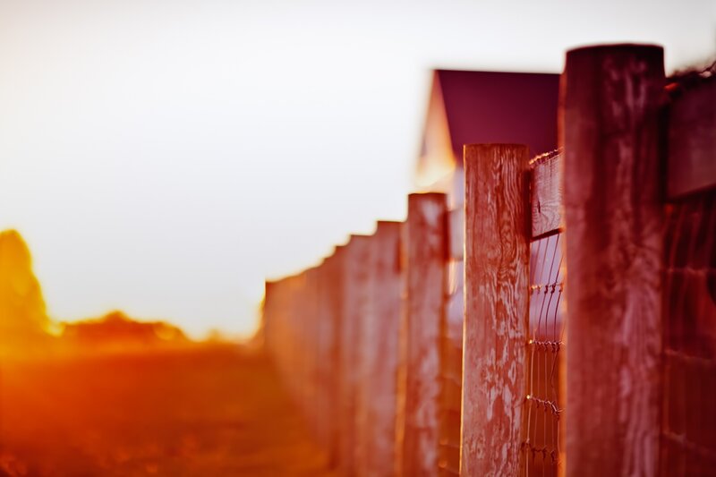 Wooden fence at sunset