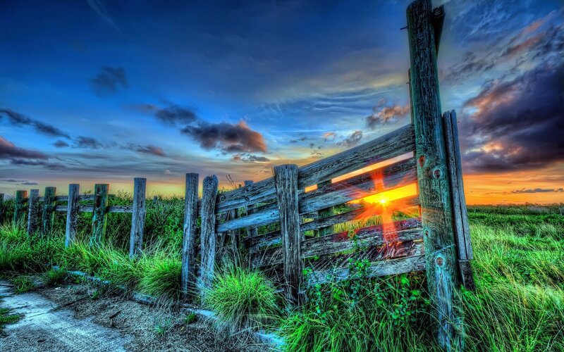 Wooden fence at sunset