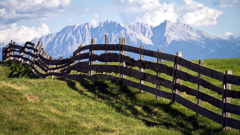 Wooden fence in mountain landscape