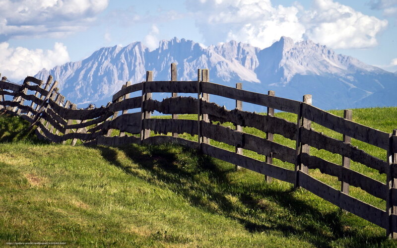 Wooden fence in mountain landscape